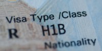 A detail of a H1B visa stamp in a passport.