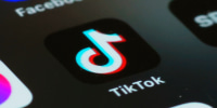 In this photo illustration, the TikTok app is seen on a phone 