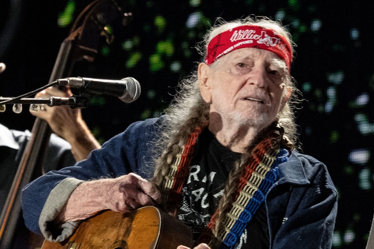 Willie Nelson performs on stage