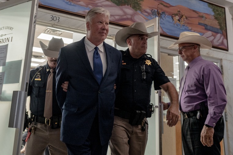 Robert Morris leaves Osage County District Court handcuffed after pleading guilty. on Oct. 2, 2025.