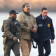 Nicolas Maduro and his wife, Cilia Flores, in handcuffs after landing at a Manhattan helipad, escorted by heavily armed Federal agents as they make their way into an armored car en route to a Federal courthouse in Manhattan on Jan. 5, 2026 in New York.