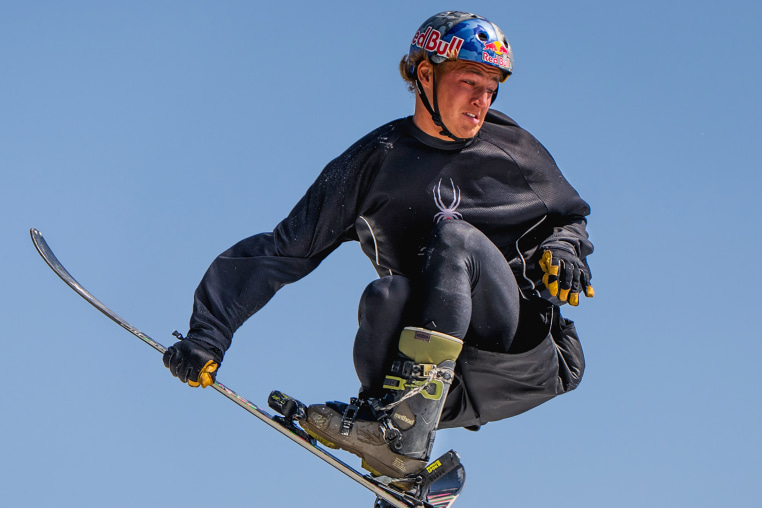 Freestyle skier Mac Forehand practices a switch triple cork 1980 mute while jumping onto an airbag