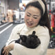 Angela He with her dog in Beijing on Jan. 21, 2026.