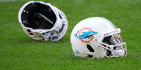 Nov 12, 2025; Madrid, Spain; Miami Dolphins helmets on the field during practice at Estadio Riyadh Air Metropolitano. Mandatory Credit: Kirby Lee-Imagn Images